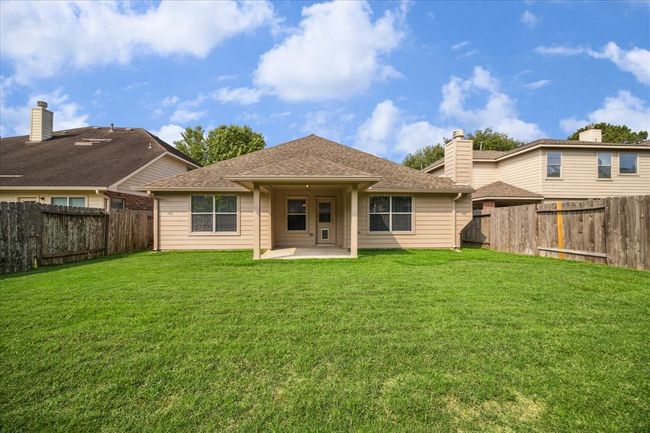 Whether you envision weekend BBQs, a serene garden retreat, a cozy fire pit, or space for a future playset or pool—this spacious backyard and covered patio are ready for whatever your imagination can dream up. | Image 25