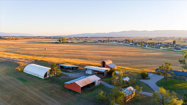Aerial view at dusk featuring a mountain view and a rural view | Image 75
