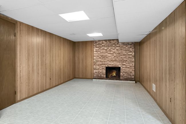Listed as Sitting Room Floor to Ceiling Fireplace | Image 20