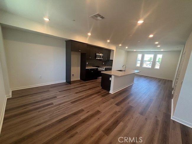 View from dining room to kitchen and living room | Image 17
