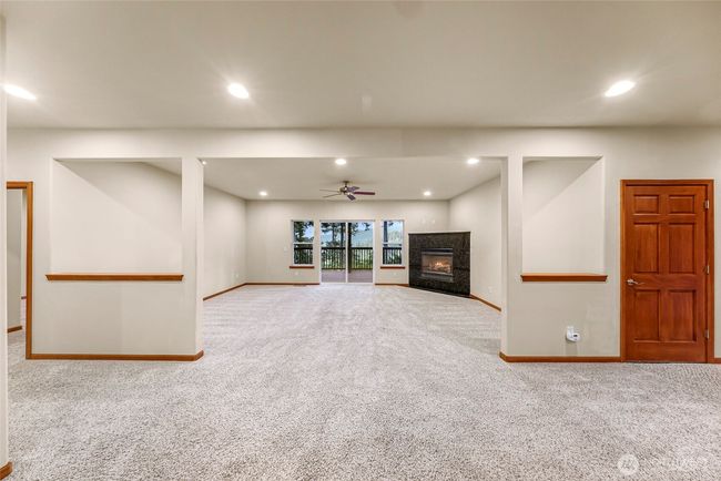 Downstairs living with another large deck and fireplace | Image 21