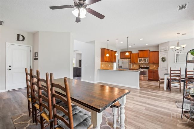 The great room is open to the kitchen. | Image 7