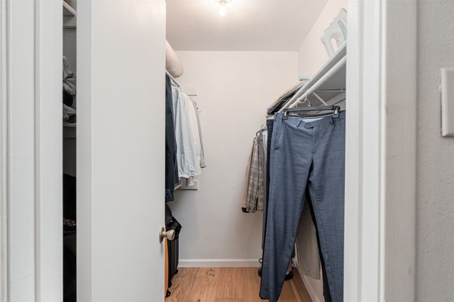 Spacious closet featuring wood finished floors | Image 14
