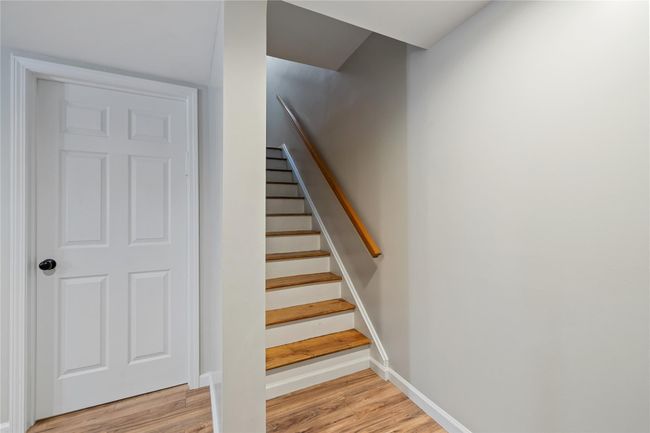 Stairway featuring baseboards and wood finished floors | Image 31