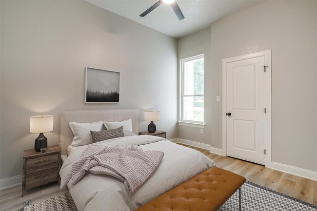 Bedroom with baseboards, ceiling fan, and light wood-style floors | Image 24