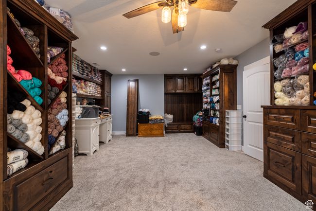 Office space featuring light colored carpet, a ceiling fan, and recessed lighting | Image 67