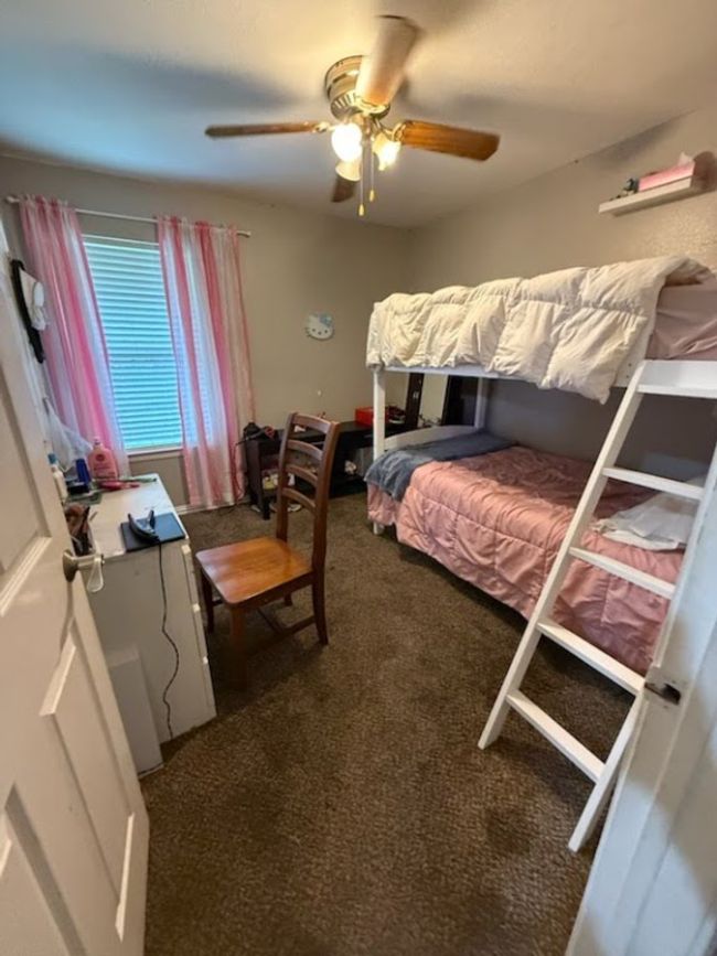 Carpeted bedroom featuring ceiling fan | Image 6