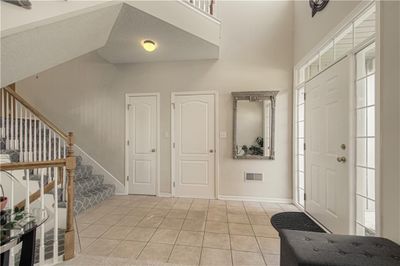 Tiled entryway with vaulted ceiling | Image 3