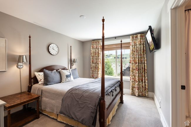 Bedroom featuring baseboards and light carpet | Image 20
