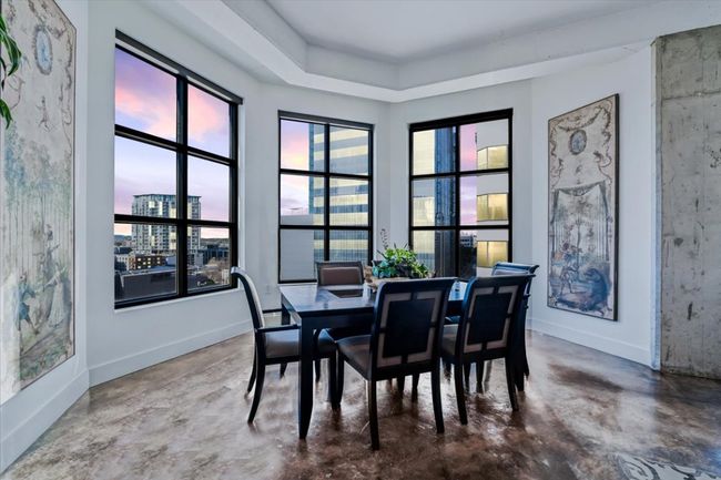 Dining room featuring concrete flooring | Image 4