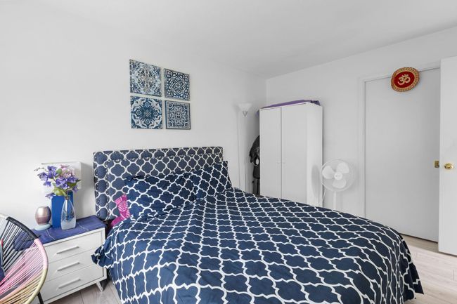 Bedroom with light wood-style floors | Image 22