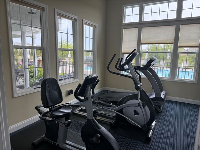 Exercise area featuring baseboards | Image 23