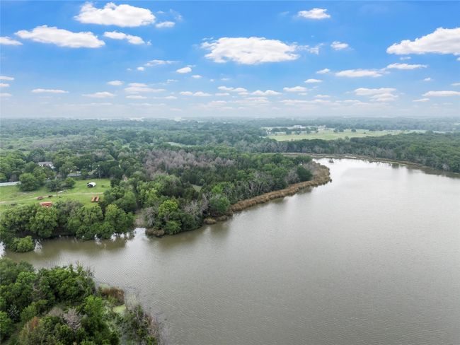 Birds eye view of property featuring a water view and a forest view | Image 10