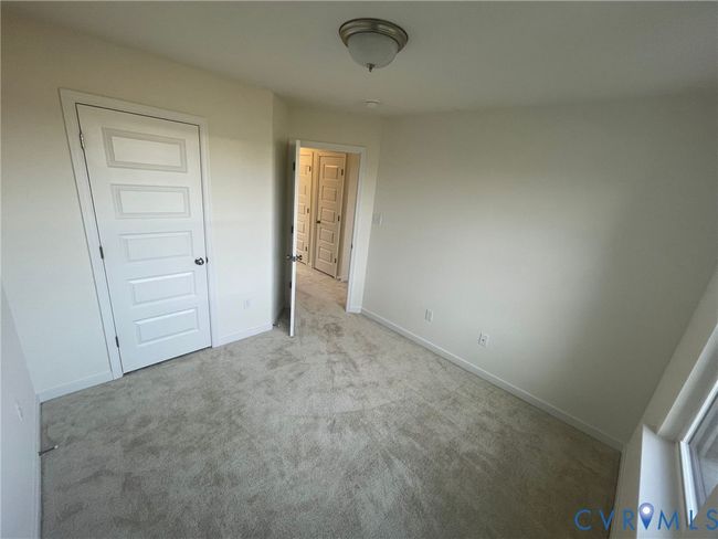 Unfurnished bedroom featuring carpet and baseboards | Image 14