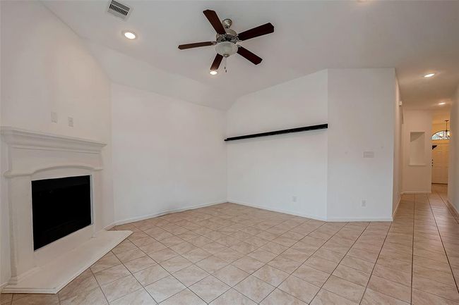 Feature fireplace is the focal point of the space | Image 25