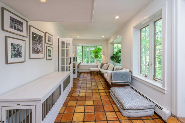 This cozy corner is a great place to sit back and relax. | Image 8