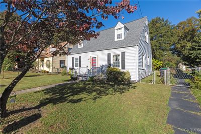 Cape cod house featuring a front yard | Image 1