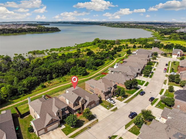 Aerial view of residential area featuring a nearby body of water | Image 40