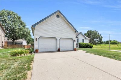 View of front of house with a garage and a front yard | Image 2