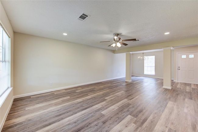 Family room has new ceiling fan and new LED recessed lighting | Image 6