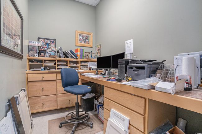 Office area featuring radiator heating unit | Image 15