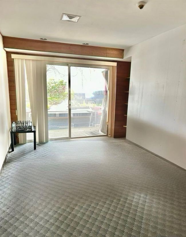 Carpeted spare room with a wealth of natural light | Image 31