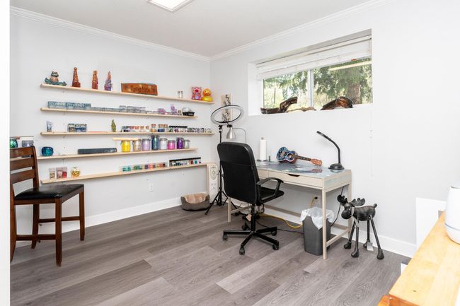 Home office with ornamental molding, wood finished floors, and baseboards | Image 20