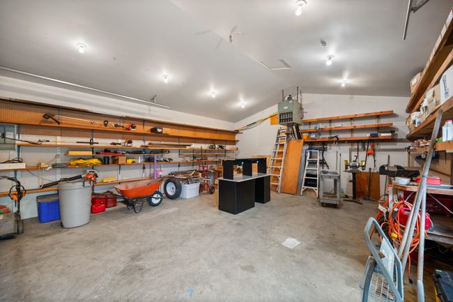 Garage with a workshop area | Image 33