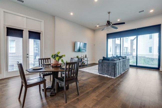 Second level - soaring ceilings and so much natural light. Here is your open concept kitchen, living and dining space. | Image 8