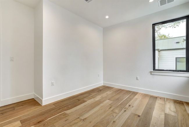 Empty room featuring light wood-style floors and recessed lighting | Image 21
