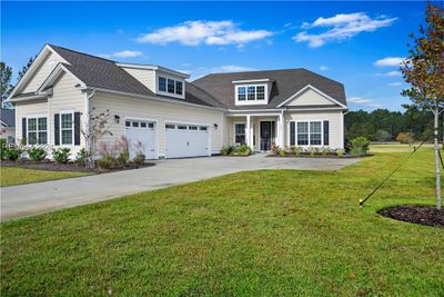 View of front facade with a front yard | Image 3