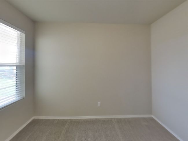 Carpeted spare room featuring plenty of natural light | Image 11