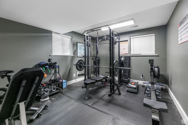 Exercise room featuring visible vents and baseboards | Image 32