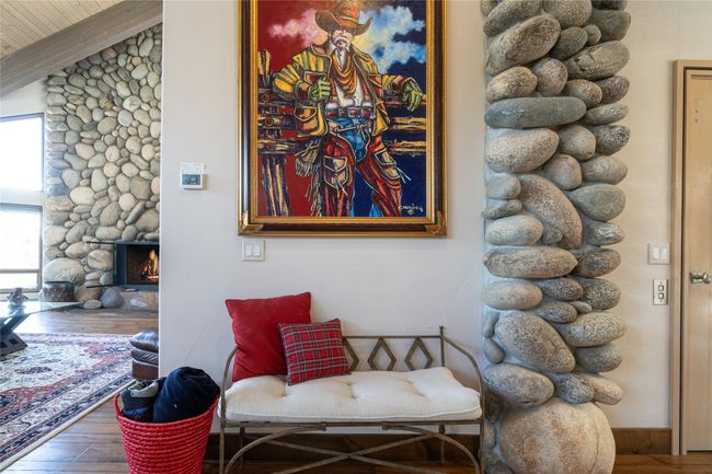 Living area featuring vaulted ceiling, a fireplace, and wood-type flooring | Image 9