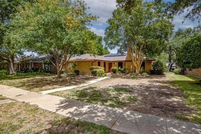 Ranch-style home featuring a front yard and solar panels | Image 2