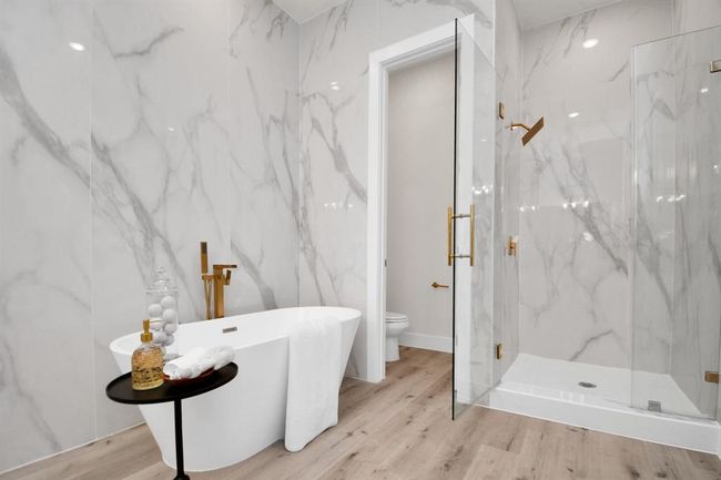 Another view of your soaking tub and standing shower. Floor to ceiling tile surround. | Image 19