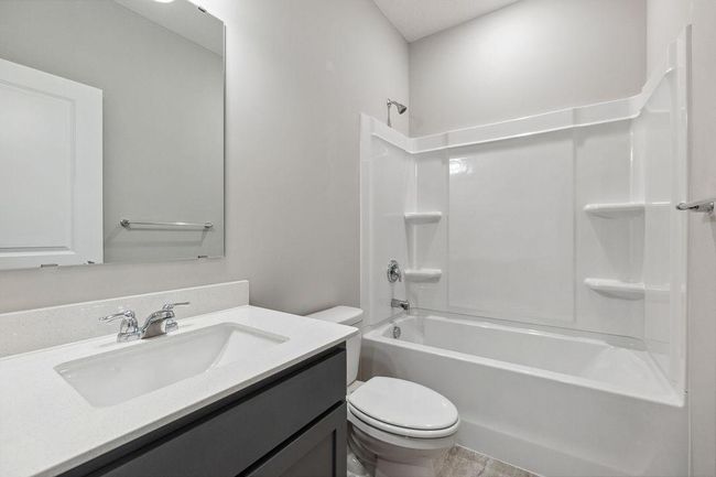 Desirable main floor bedroom with full bath. Model photo. Options and colors will vary. | Image 16