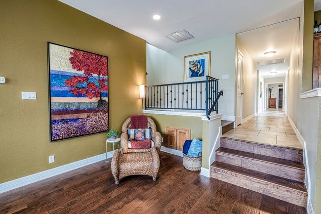 Den sitting area with walkway to office stairs behind | Image 22