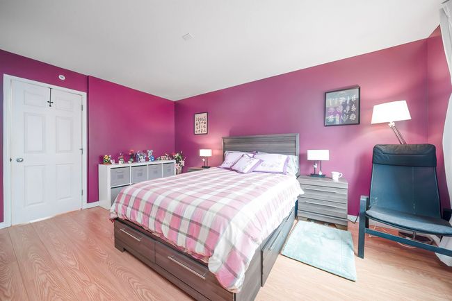 Bedroom with light wood-type flooring and baseboards | Image 29
