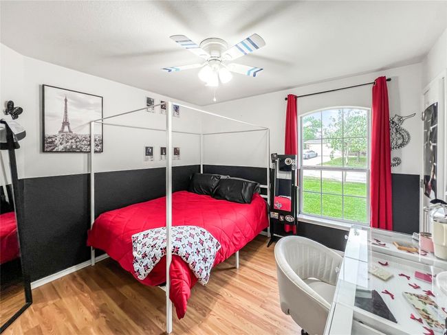Bedroom featuring wood finished floors and a ceiling fan | Image 6