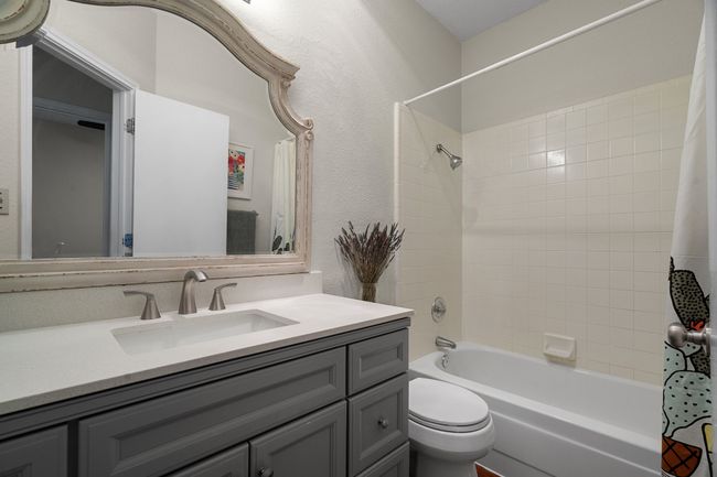 Full bath featuring vanity and shower / tub combo | Image 22