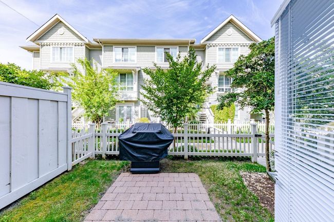 View of fenced backyard | Image 34