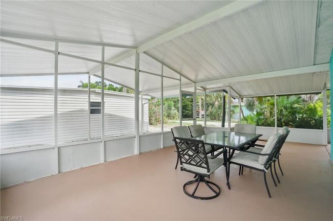 Sunroom / solarium featuring outdoor dining space and vaulted ceiling | Image 10