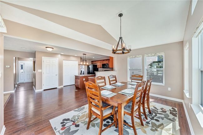 This morning room features updated lighting and a wealth of natural light | Image 17