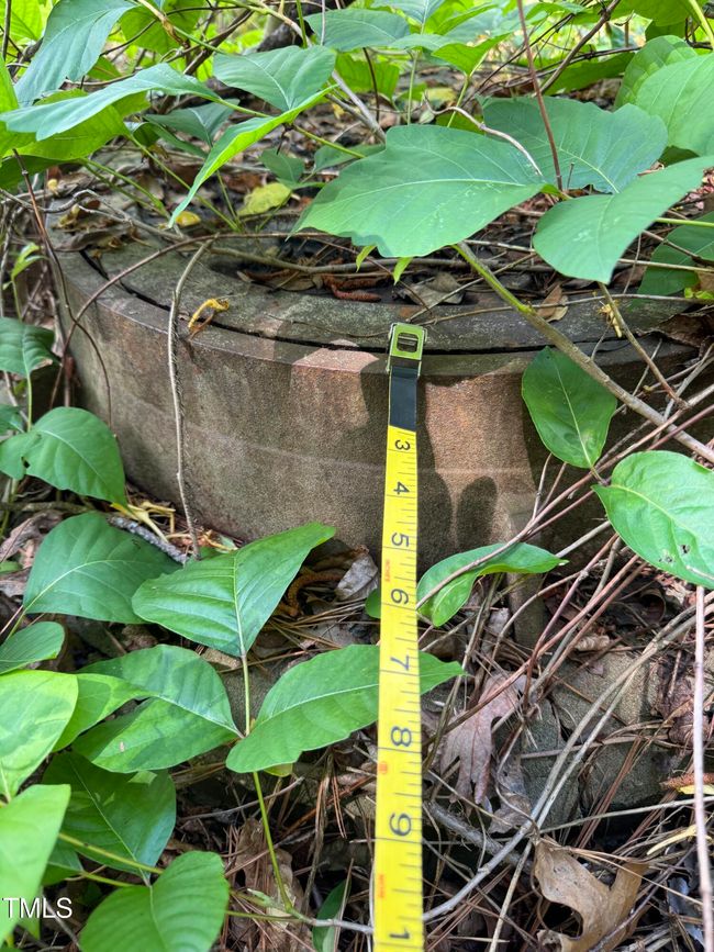 Sewer manhole showing measuring tape tou | Image 7