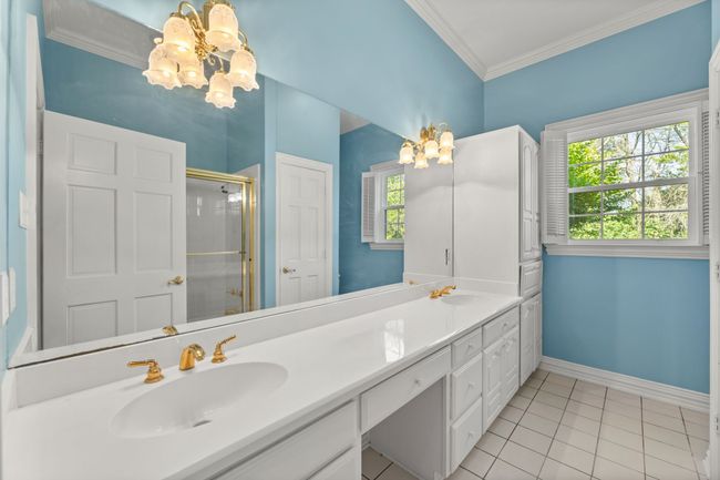 Bathroom with a shower stall, double vanity, crown molding | Image 22