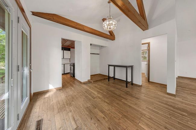 Vaulted Dining/Living Room with beautiful hardwood floors | Image 21