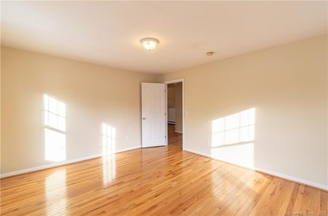 Bedroom with hardwood floors and plenty of closet space | Image 5