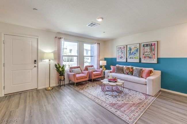 Living room with baseboards, visible vents, and wood finished floors | Image 5