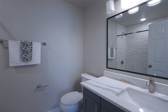 Bathroom with vanity and a shower | Image 18